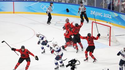 Canada celebrates winning the gold medal.