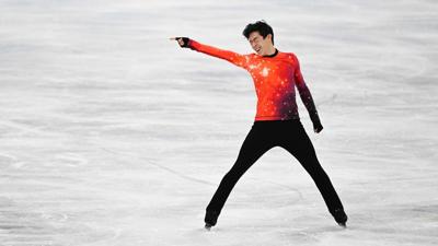 Nathan Chen points to the left