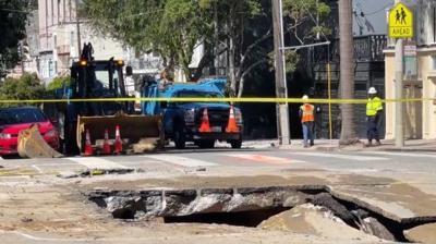 Huge sinkhole from water main break closes intersection