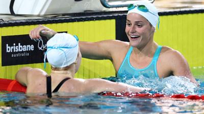 BRISBANE, AUSTRALIA - JUNE 11: Mollie O’Callaghan of Queensland celebrates with Kaylee McKeown of Queensland after the Women’s 100m Backstroke Final during the 2024 Australian Swimming Trials at Brisbane Aquatic Centre on June 11, 2024 in Brisbane, Aust...