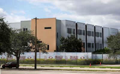 Demolition of Parkland high school massacre site begins as some families of the victims look on